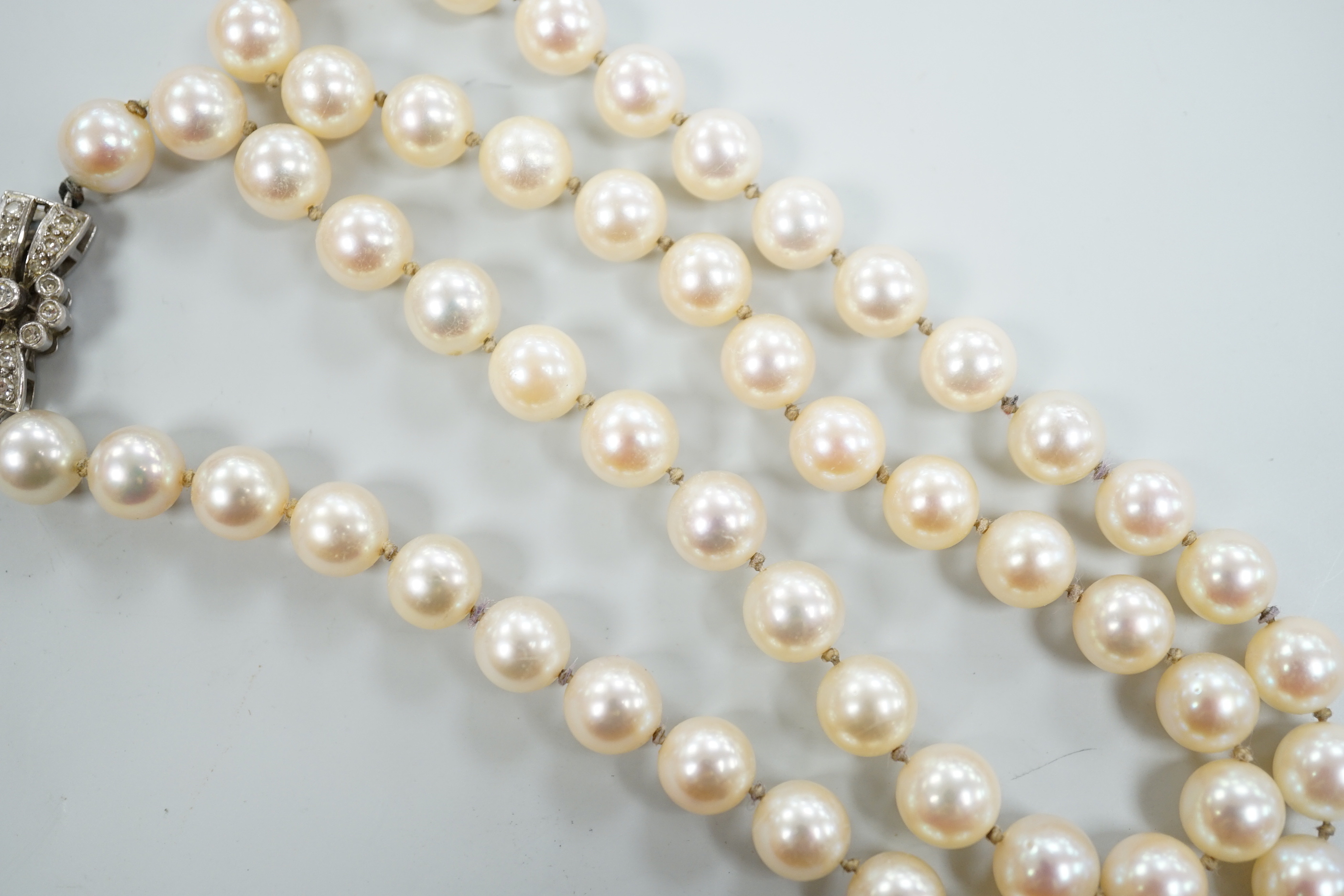A single strand cultured pearl necklace, with diamond set 18ct white gold clasp, 48cm.
